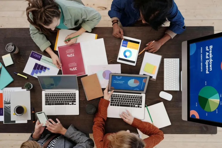 Team of SEO professionals discussing digital marketing strategy in modern office
