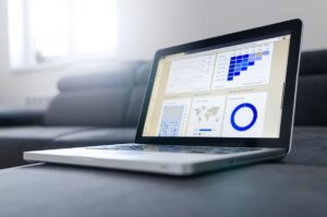 Technical SEO services: laptop displaying website analytics dashboard showing crawl errors, site speed metrics, and search performance data Rank Ray
