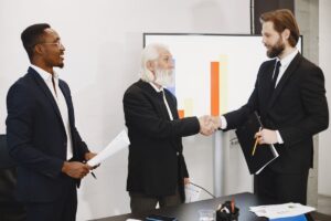 White label SEO: business partnership meeting representing agencies scaling through outsourced SEO services Rank Ray